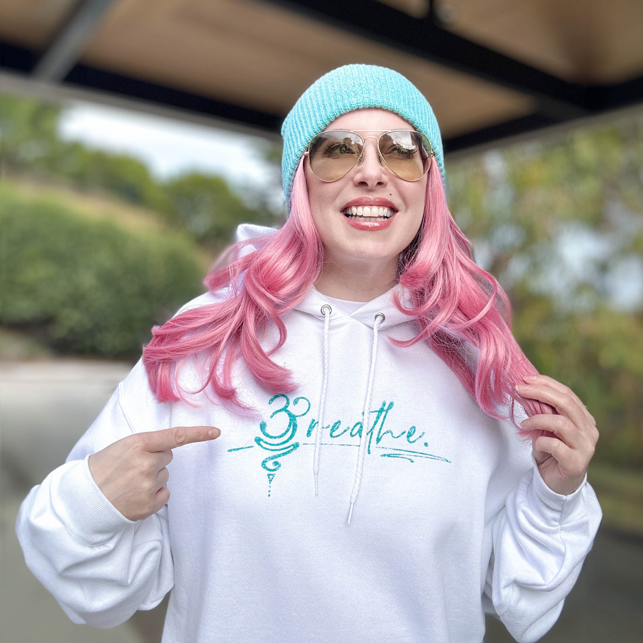 Breathe White Hoodie with teal logo.