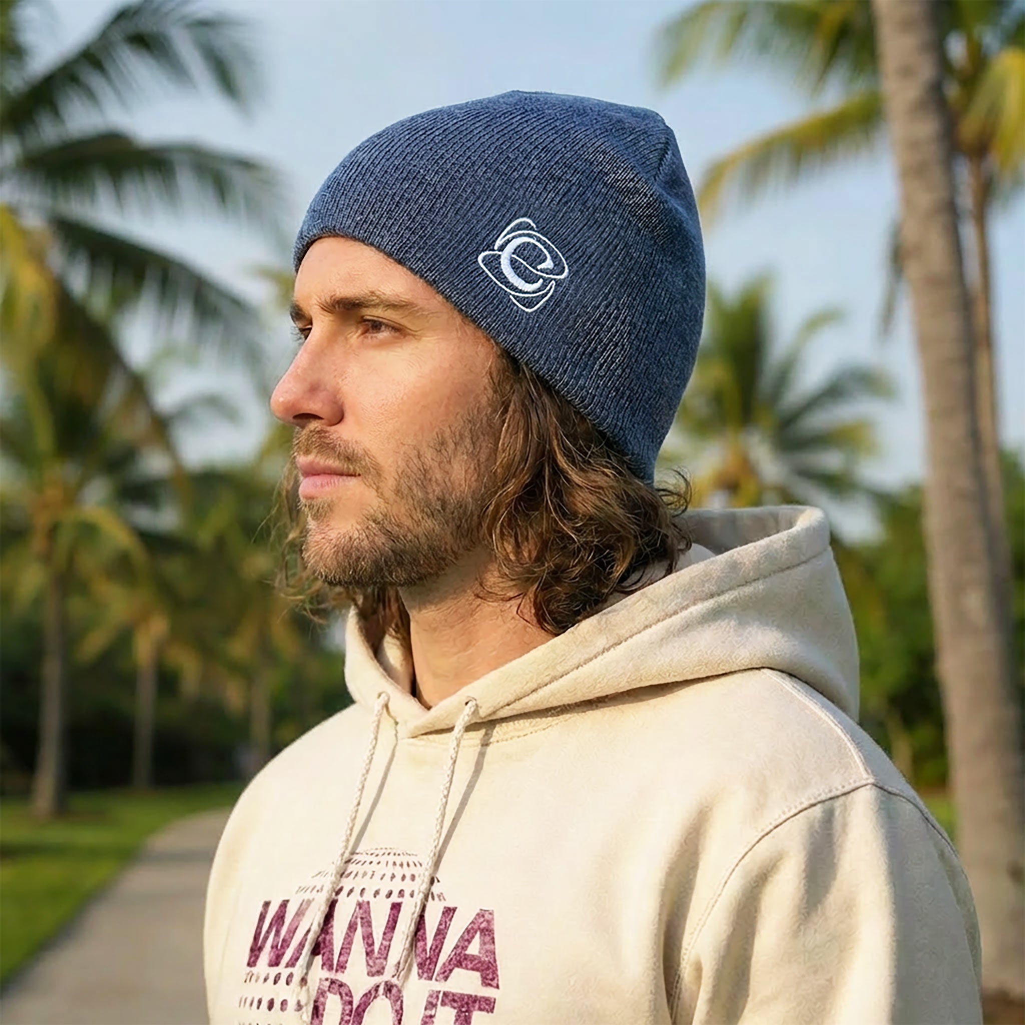 Celleste Heather Navy shorty beanie hat, with white "C" embroidered logo on the left side.