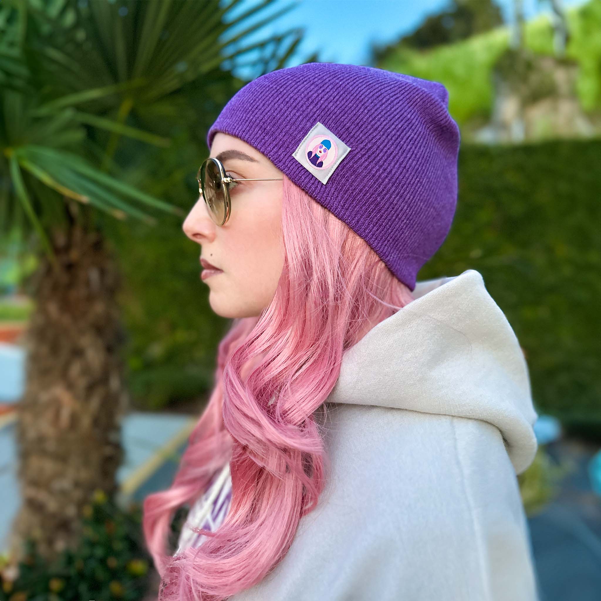 Celleste Heather Purple shorty knit beanie hat, with Signature "Avatar Tag” on the left side.