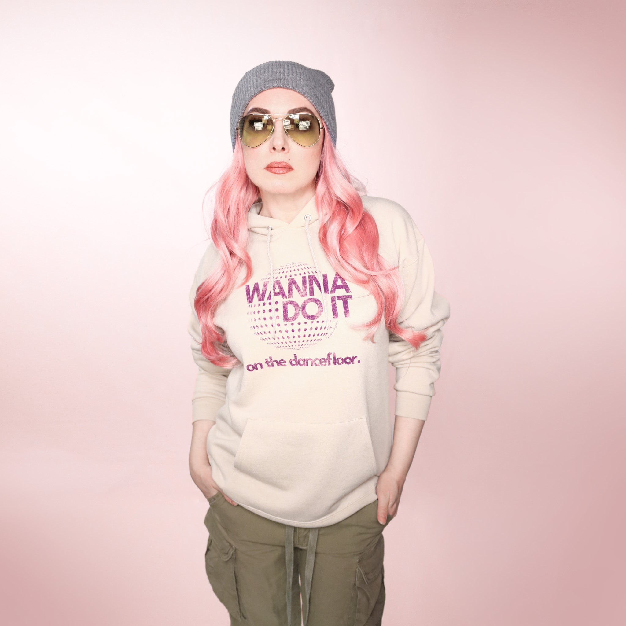 Celleste Wanna Do it Hoodie with purple logo. Sand color. Size Medium.