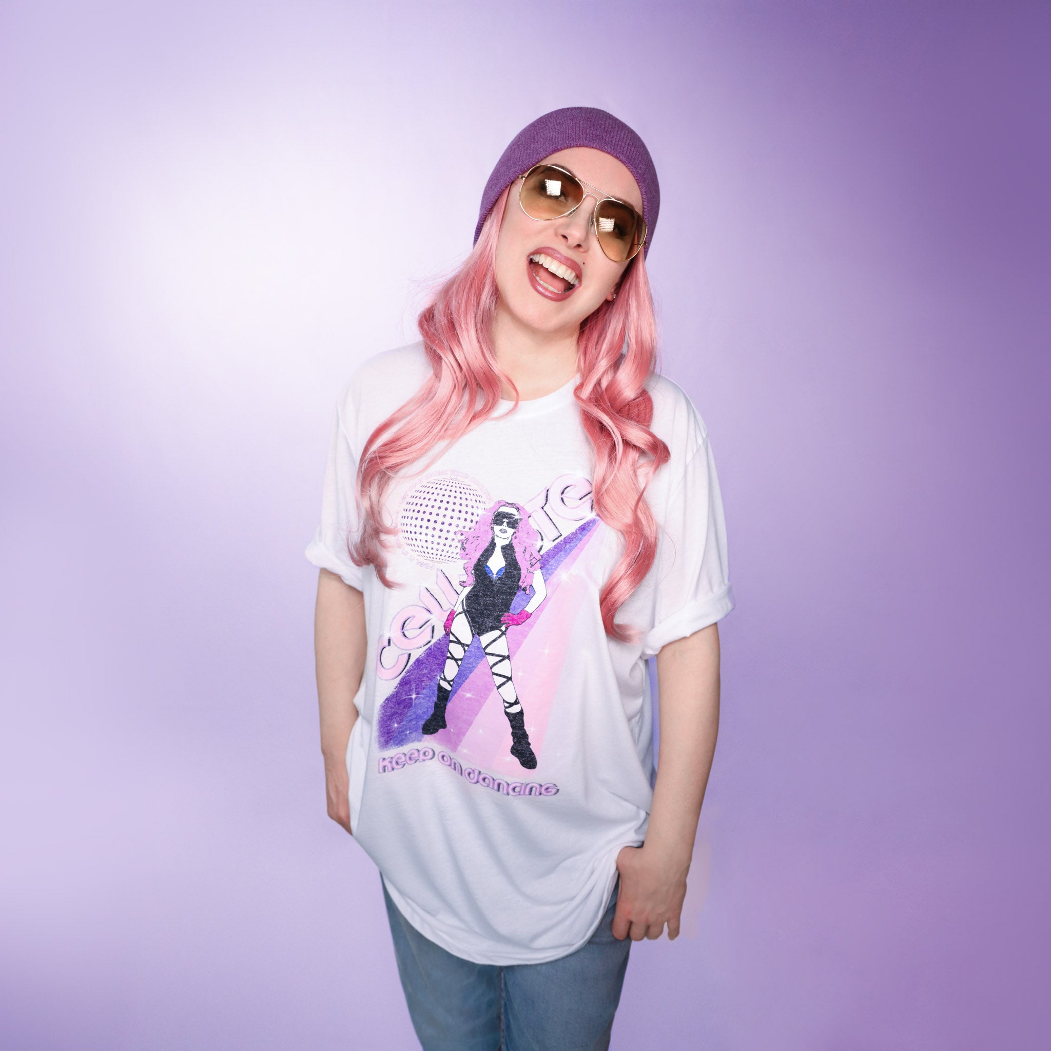 Celleste Keep On Dancing Poster Tee. White tee with purple and pink rainbow graphic showing Celleste's silhouette logo. Size 2XL.