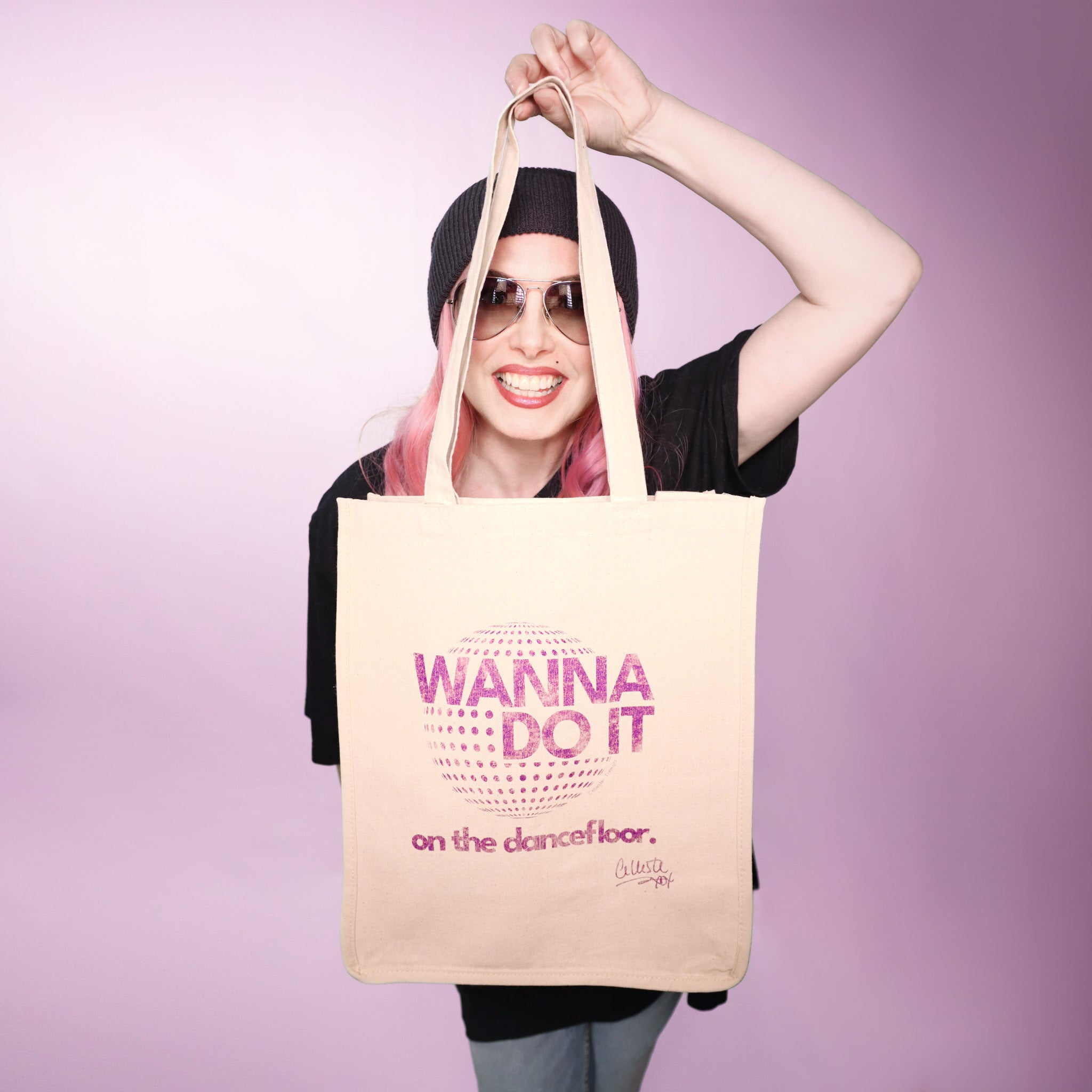 Celleste Wanna Do It natural canvas Tote Bag with purple logo.