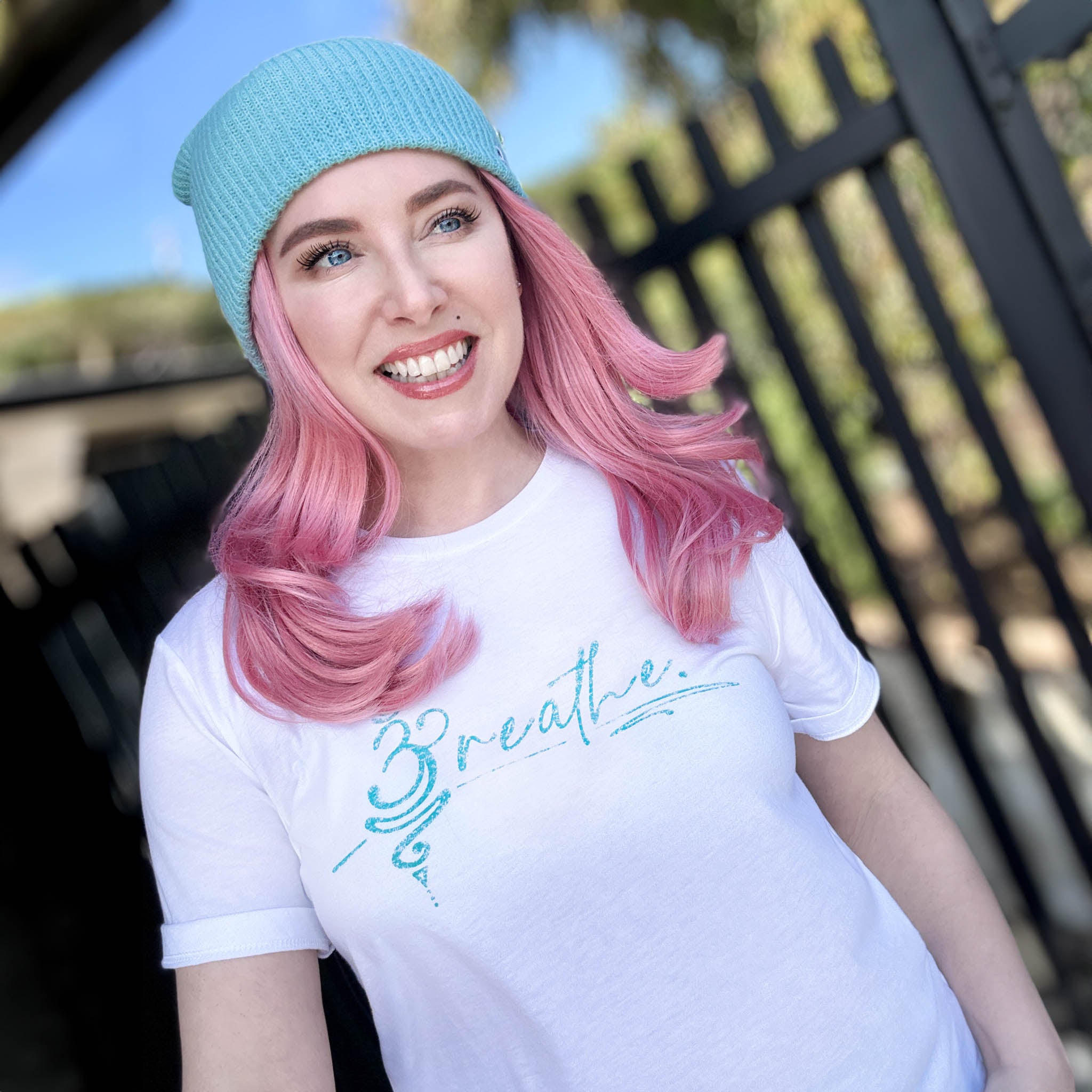 Breathe White Tee with teal logo. 
