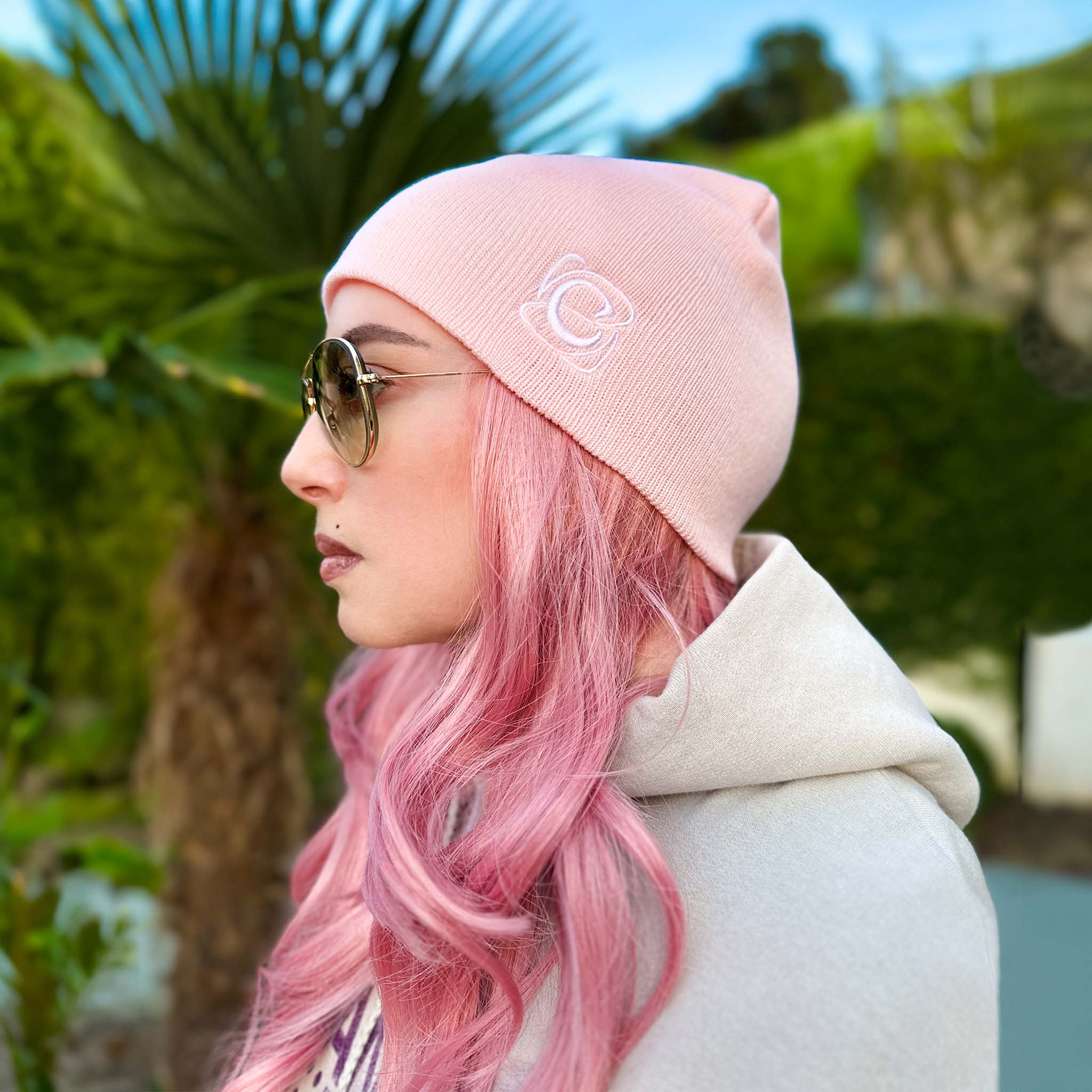 Celleste Pink shorty beanie hat, with white "C" embroidered logo on the left side. 