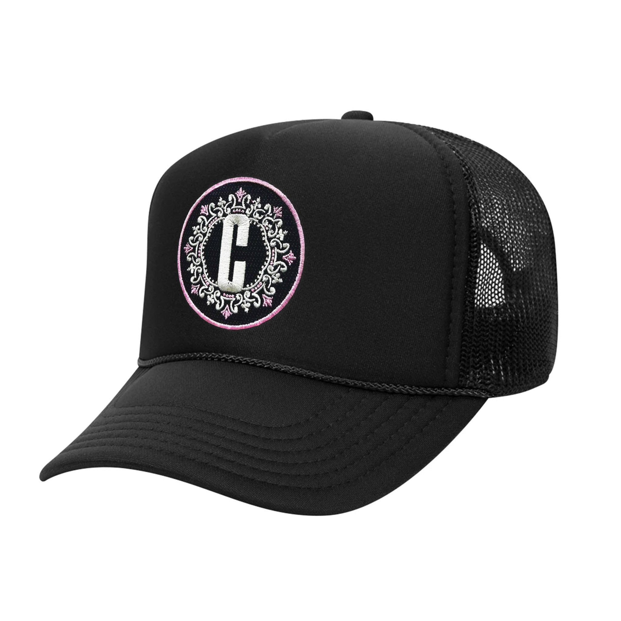 Celleste "C" logo Trucker hat with embroidered black, white and pink patch. Side view.