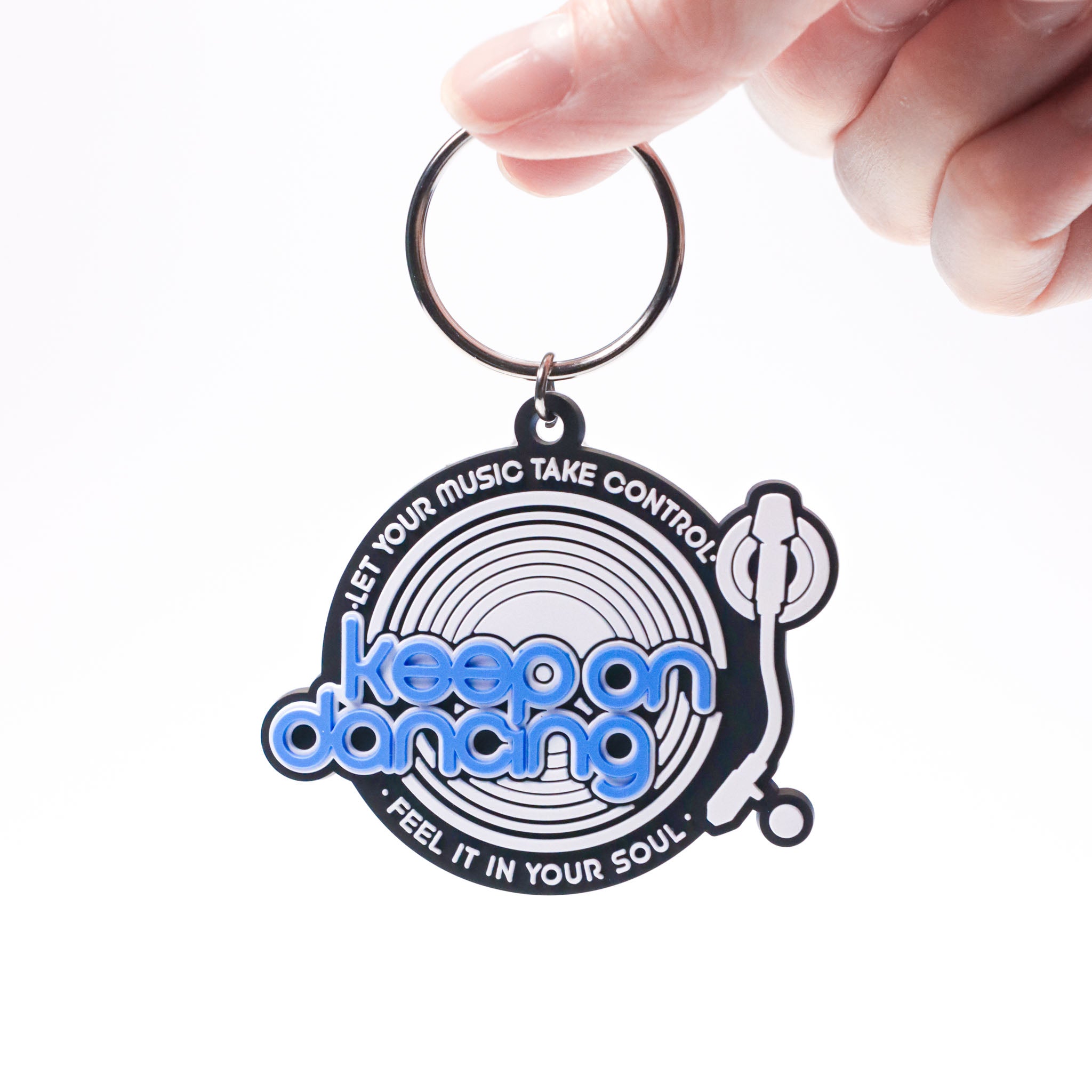 Celleste Keep on Dancing black, white and blue logo keychain. 
