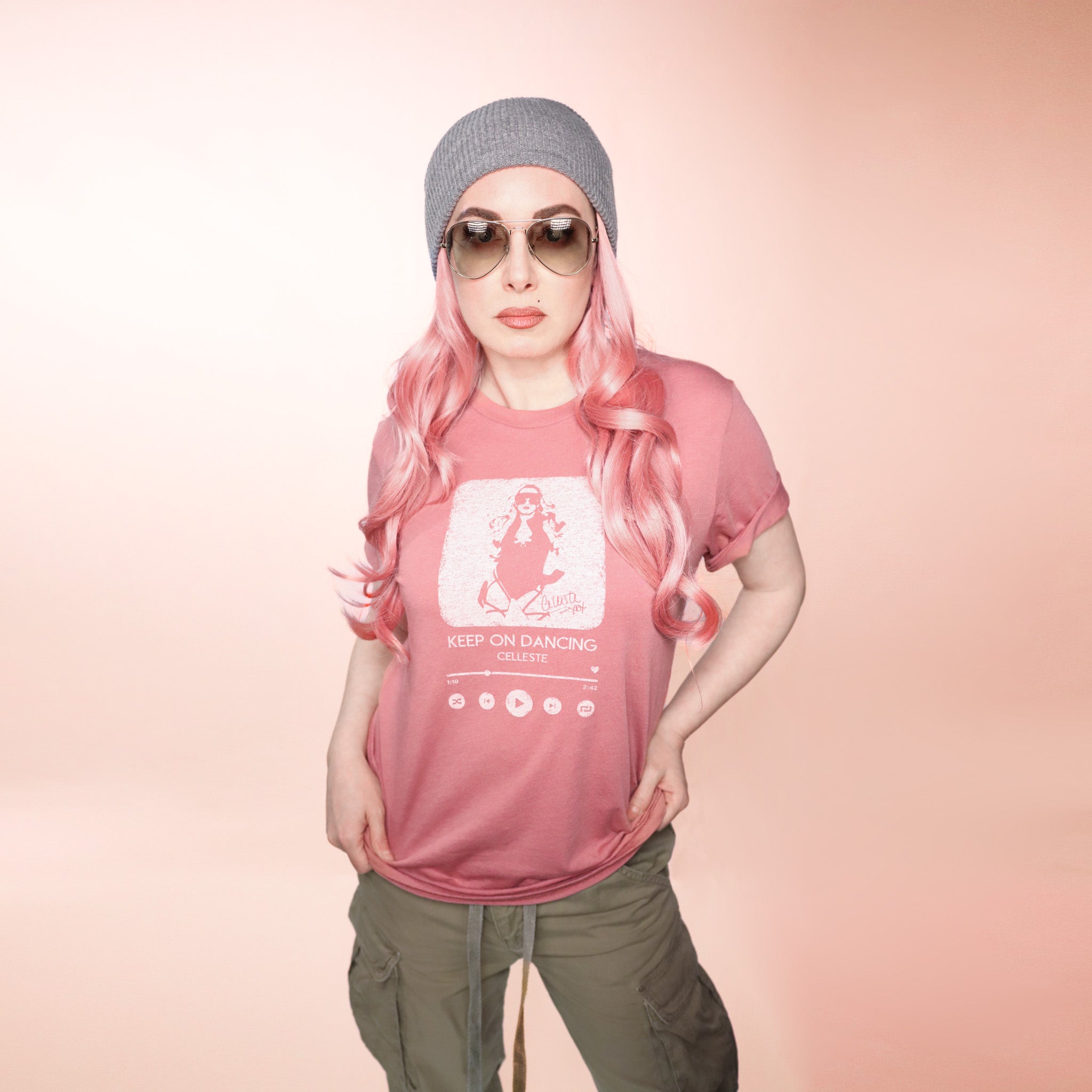 Keep on Dancing mauve T-shirt with Celleste streaming player logo in white. Size Medium.