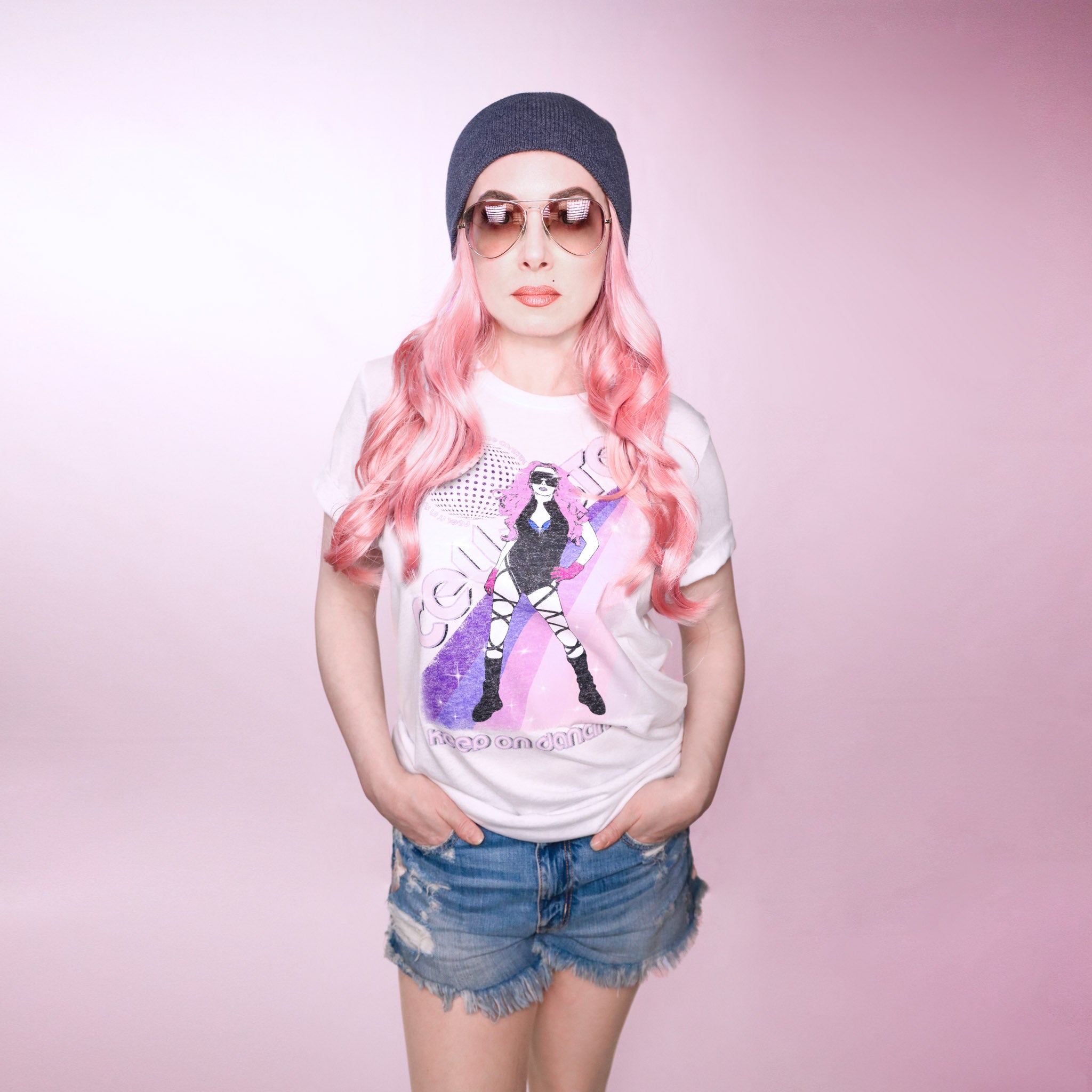 Celleste Keep On Dancing Poster Tee. White tee with purple and pink rainbow graphic showing Celleste's silhouette logo. Size Medium.